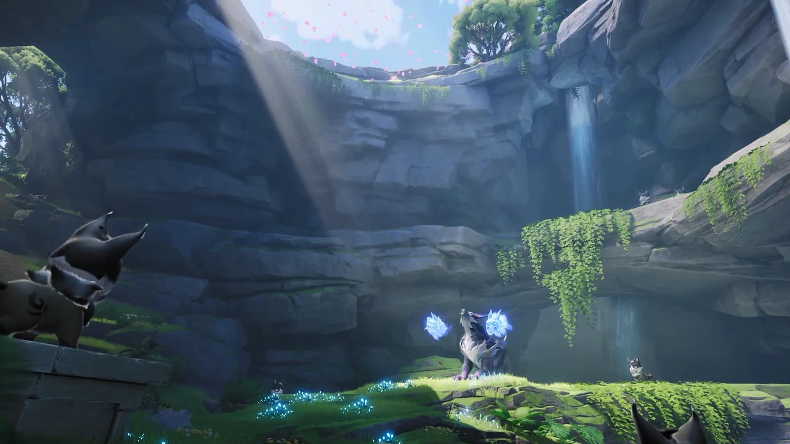 Dark Aniimo watching from a rock ledge as a pale wolf Aniimo raises blue flames on a mossy shelf in a sunlit gorge